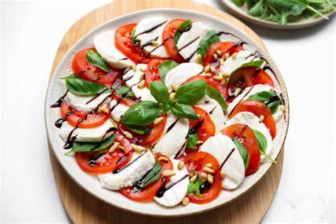 Olijfolie en balsamico bij caprese salade
